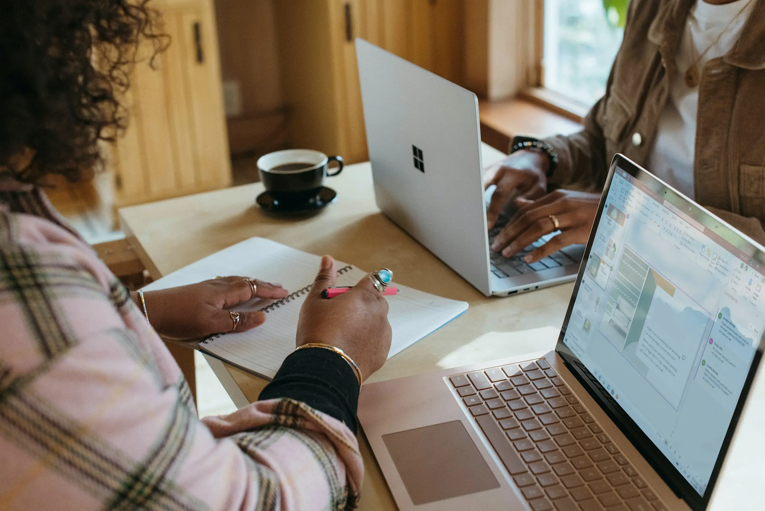 People working on corporate learning strategy by computer 